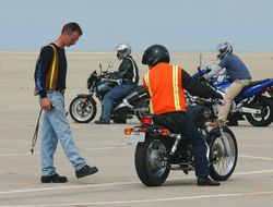US Navy 040708-N-8970J-002 Motorcycle safety class instructor Chief Aviation Electronics Technician Dan Ganet shows a student where he should have stopped, during motorcycle driver training at Naval Auxiliary Landing Field (NAL.jpg